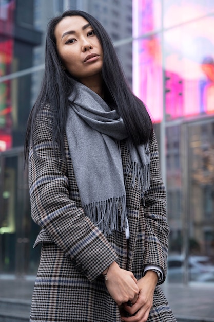 Medium shot woman posing outdoors