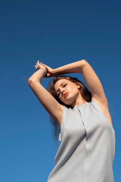 Medium shot woman posing outdoors