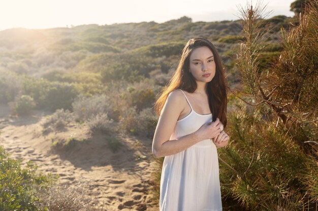 Medium shot woman posing outdoors