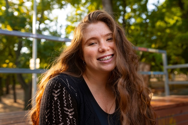 Medium shot woman posing outdoors