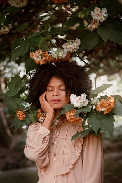 Medium shot woman posing in romantic garden