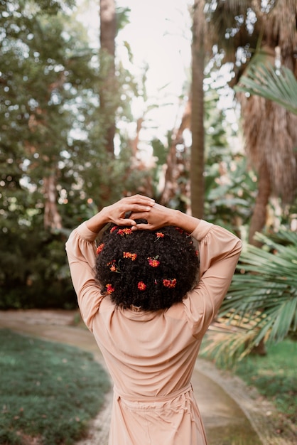 Medium shot woman posing in romantic garden