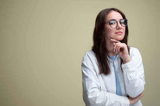 Medium shot woman posing in studio