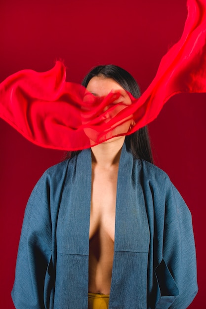 Medium shot woman posing with cloth