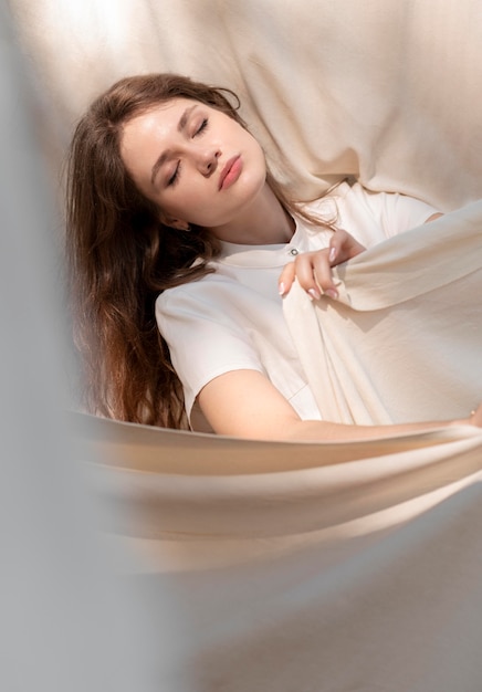 Medium shot woman posing with cloth