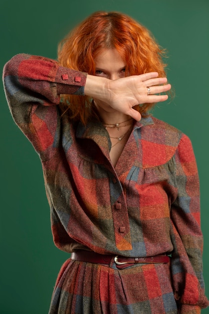 Free photo medium shot woman posing with green background