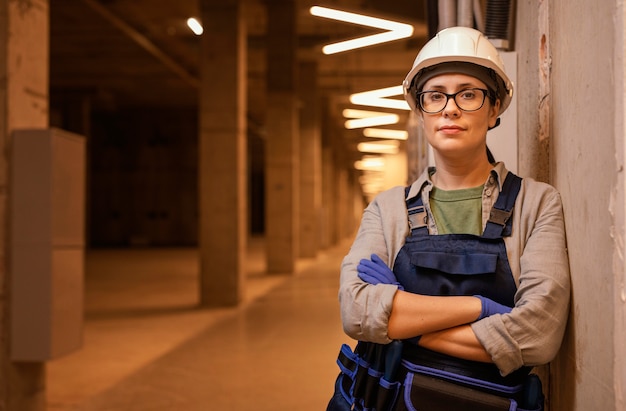 Medium shot woman posing with helmet