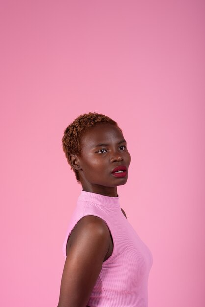 Medium shot woman posing with pink outfit