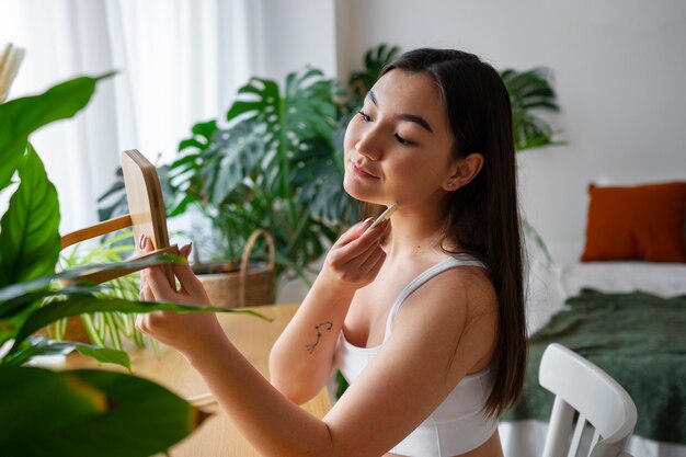 Free Photo medium shot woman practicing selfcare
