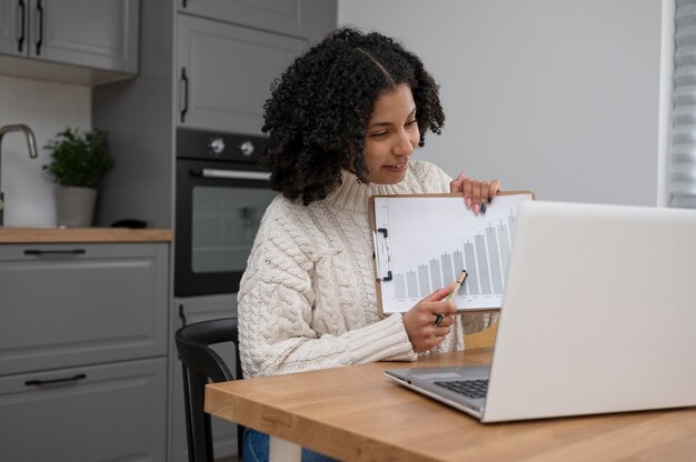 Medium shot woman presenting statistics