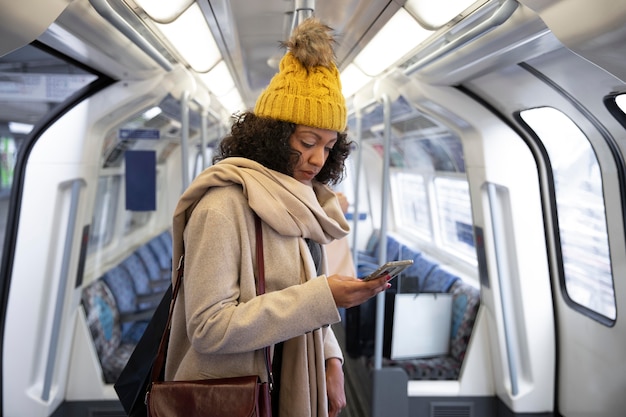 Medium shot woman in public transport