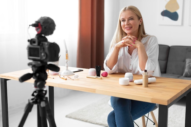 Medium shot woman recording