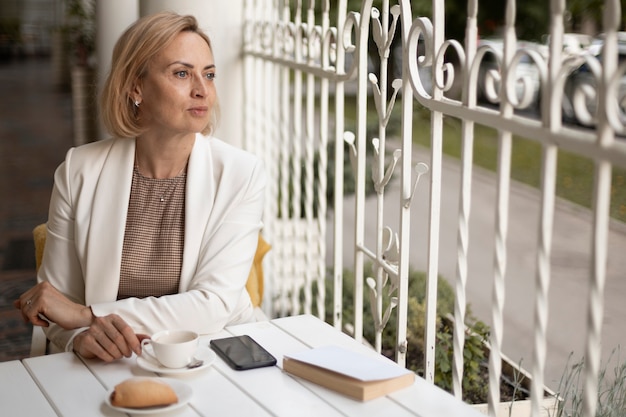 Medium shot woman at restaurant