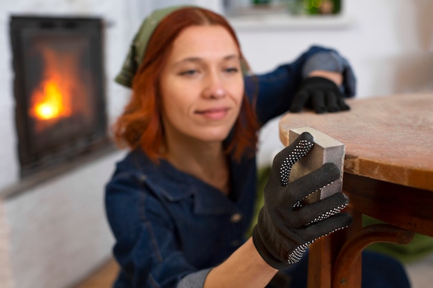 Free photo medium shot woman restoring furniture