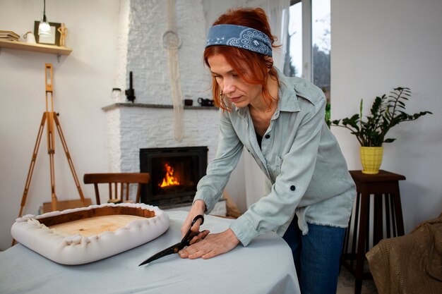 medium shot woman restoring furniture