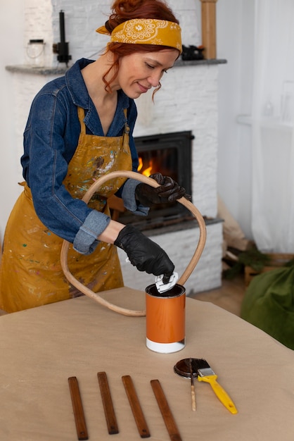 Free photo medium shot woman restoring furniture