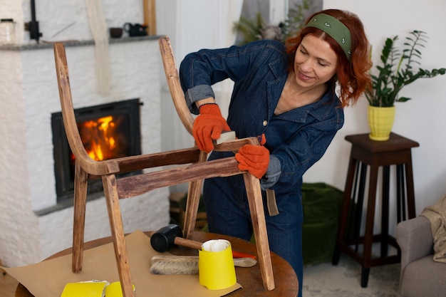 medium shot woman restoring furniture
