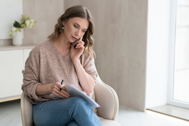 Medium shot woman sitting on chair