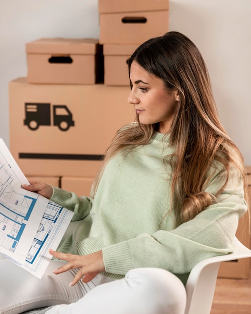 Free photo medium shot woman sitting on chair