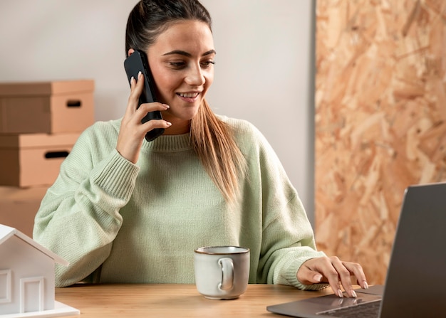 Medium shot woman sitting at desk