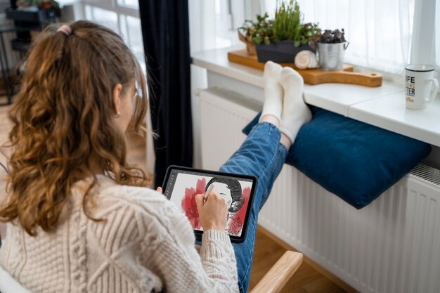 Medium shot woman sitting near heater
