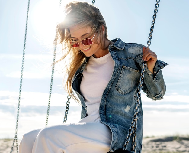 Medium shot woman sitting on swing