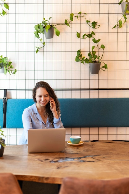 Free photo medium shot woman sitting at table