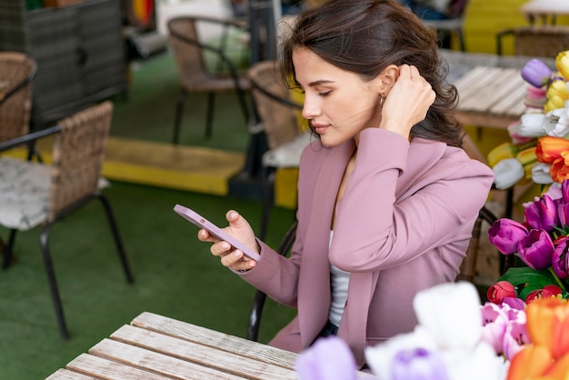 Free photo medium shot woman sitting at table