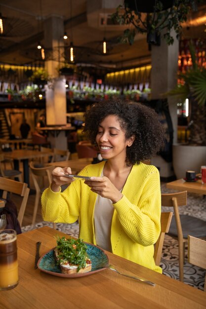 Medium shot woman sitting at table