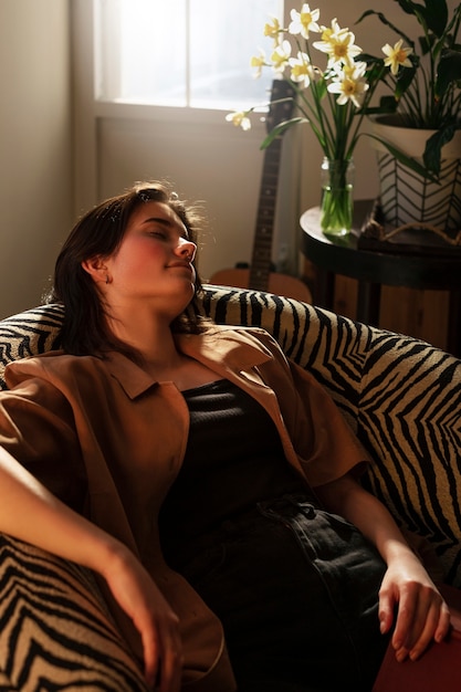 Medium shot woman sleeping on chair