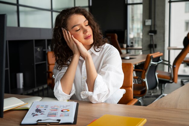 Medium shot woman stretching at work