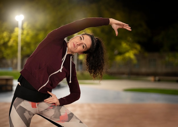 Medium shot woman stretching