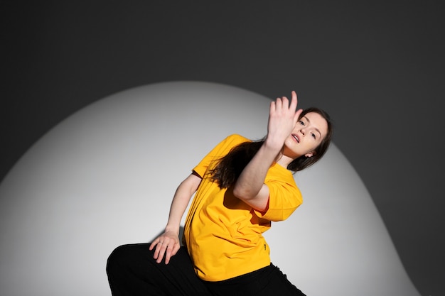 Medium shot woman in studio posing