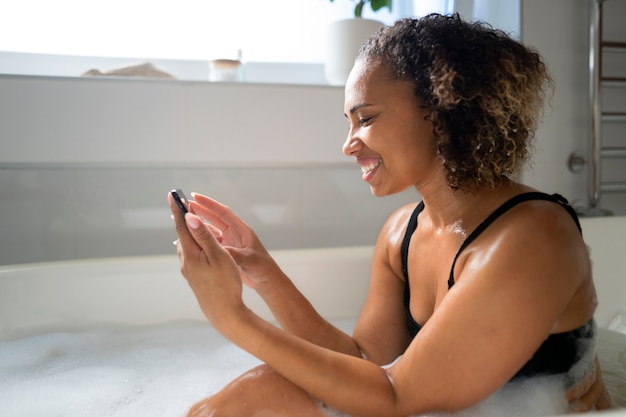 Medium shot woman taking bath