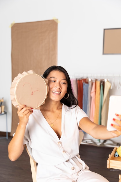 Medium shot woman taking selfie