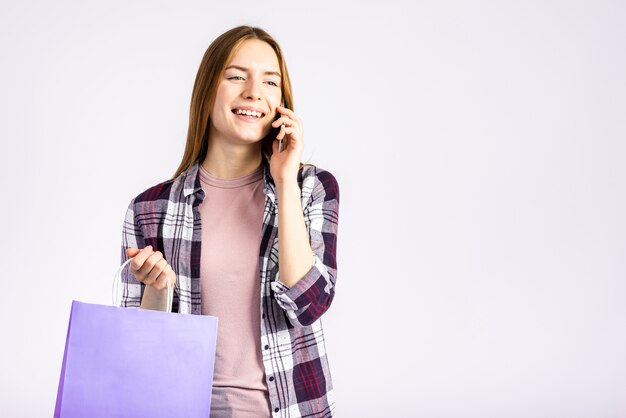 Medium shot woman talking on the phone 