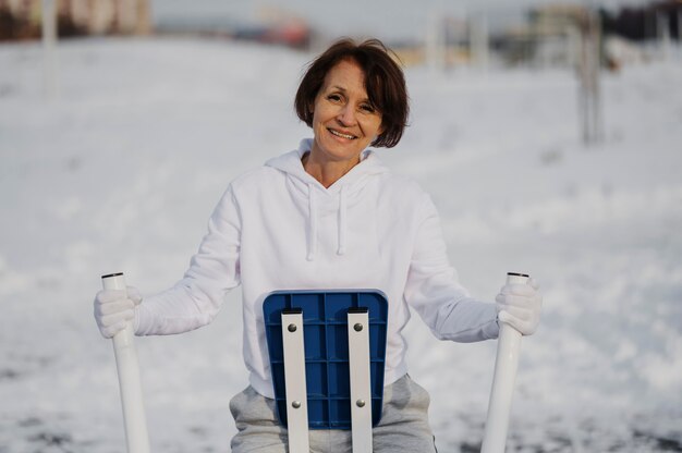 Medium shot woman training outdoors