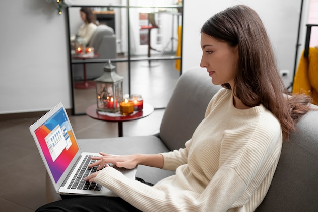 Free photo medium shot woman typing on keyboard