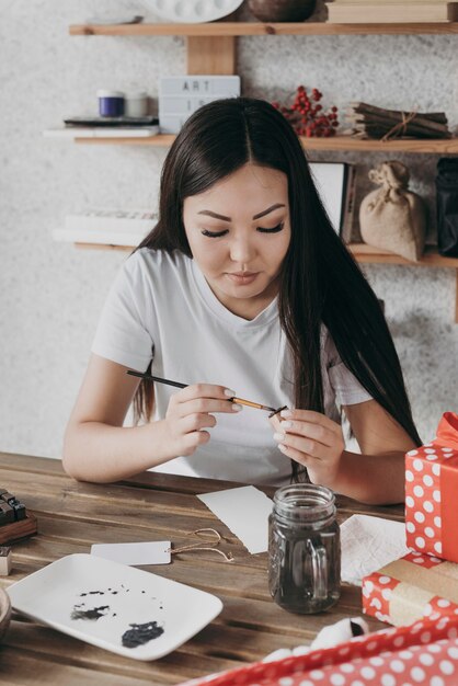 Medium shot woman using brush