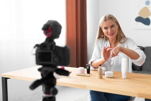 Medium shot woman using product