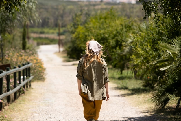 Medium shot woman walking outdoors