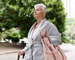 Free photo medium shot woman walking