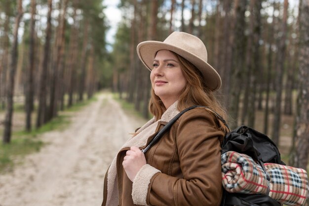 Medium shot woman wearing backpack