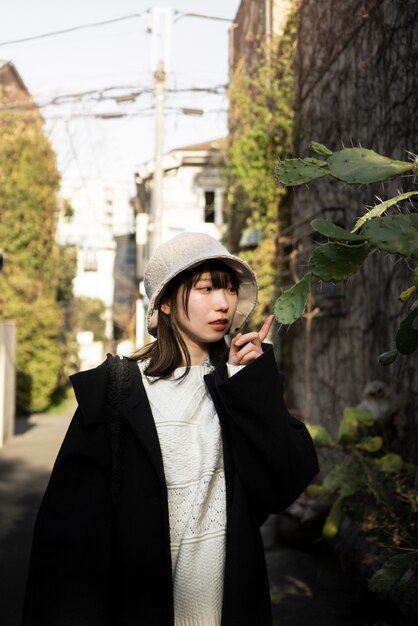 Medium shot woman wearing bucket hat