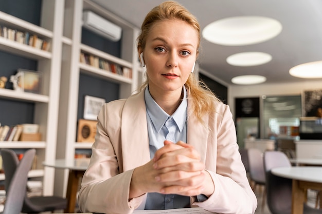 Free photo medium shot woman wearing earphones