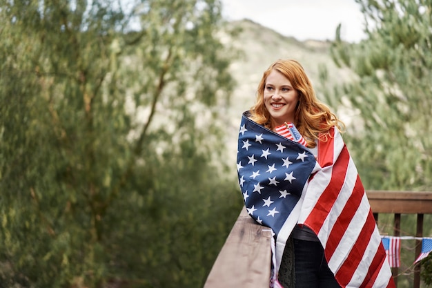 Medium shot woman wearing flag