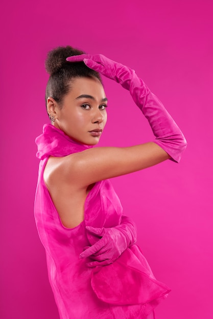 Medium shot woman wearing full pink outfit