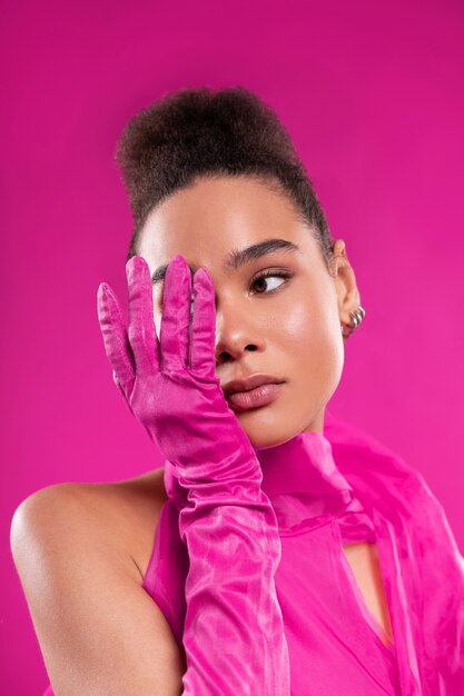 Medium shot woman wearing full pink outfit