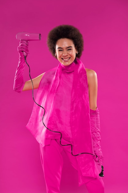 Free photo medium shot woman wearing full pink outfit