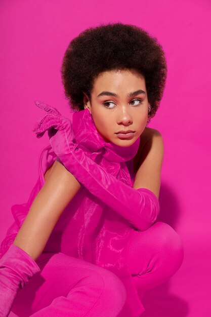 Medium shot woman wearing full pink outfit